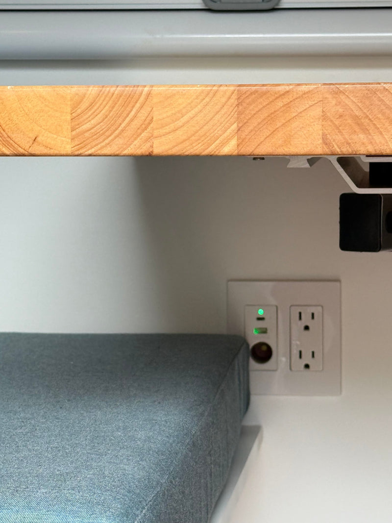  and other utility connections.|Modern RV rental interior: integrated Dometic fridge — photo 6