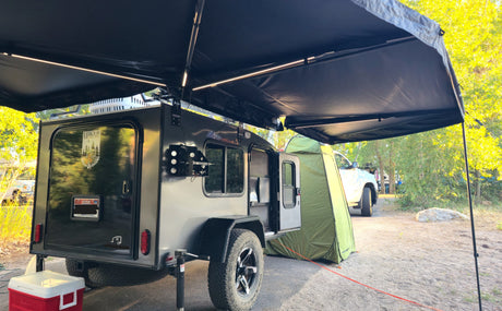 The awning sets up super easy and has lights that can be run from a power bank that can be re-charged from the battery. 
