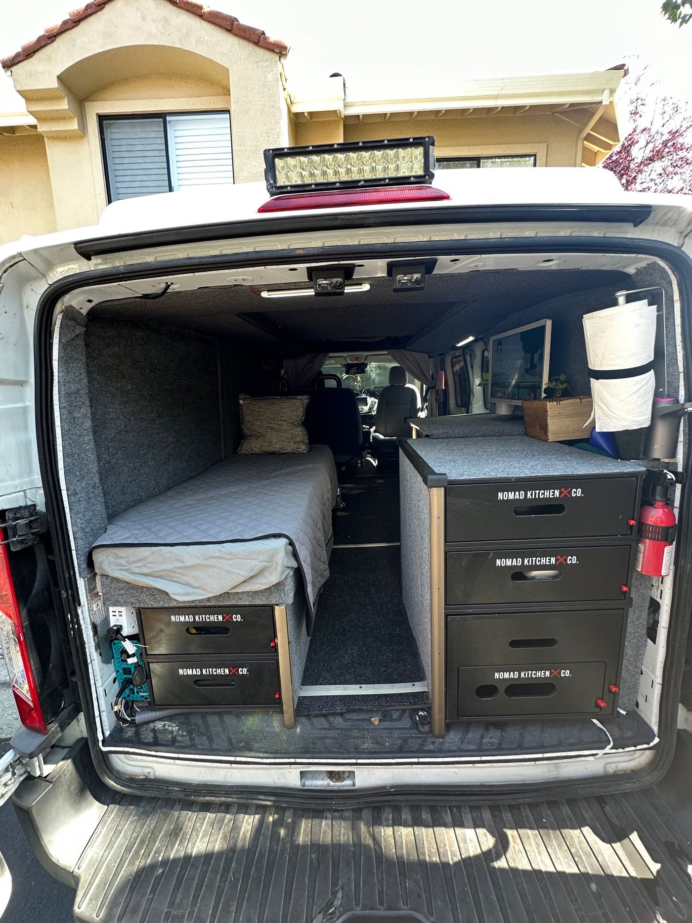  and carpeted walls.|This RV rental's cozy van conversion features a TV — photo 10