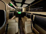 Spacious luxury RV rental interior: cream quilted seats, ambient lighting, and dark wood-style flooring for comfort.