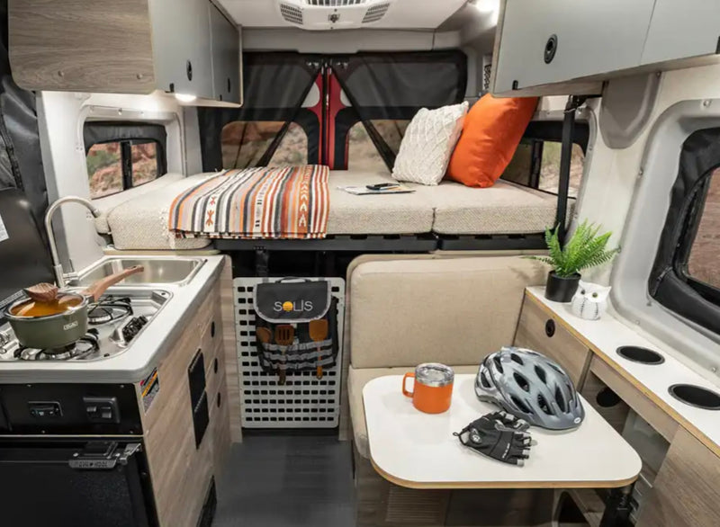 perfect for an rv rental adventure.|Compact RV rental interior featuring a kitchen — photo 3