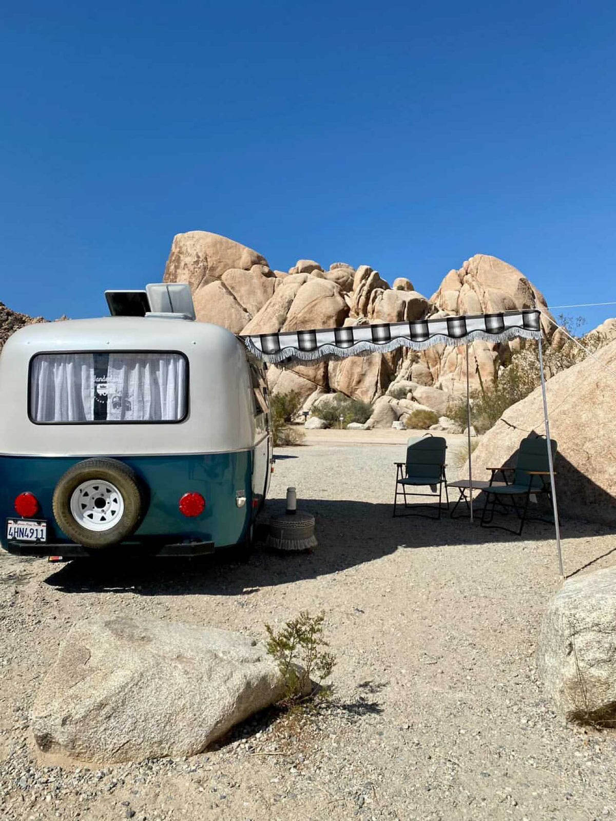 clean space.|Inviting RV rental interior showcasing a cozy bed with patterned blankets/pillows — photo 19