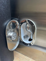RV rental outdoor shower: Two open chrome panels show a sprayer & quick connect, plus hot/cold water faucet.