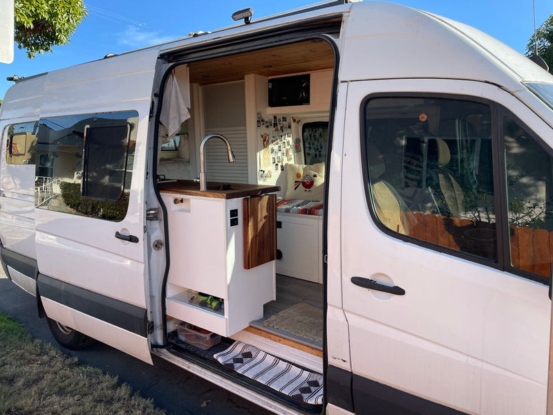  and cozy seating area.|Cozy rv rental interior featuring a wooden ceiling — photo 4