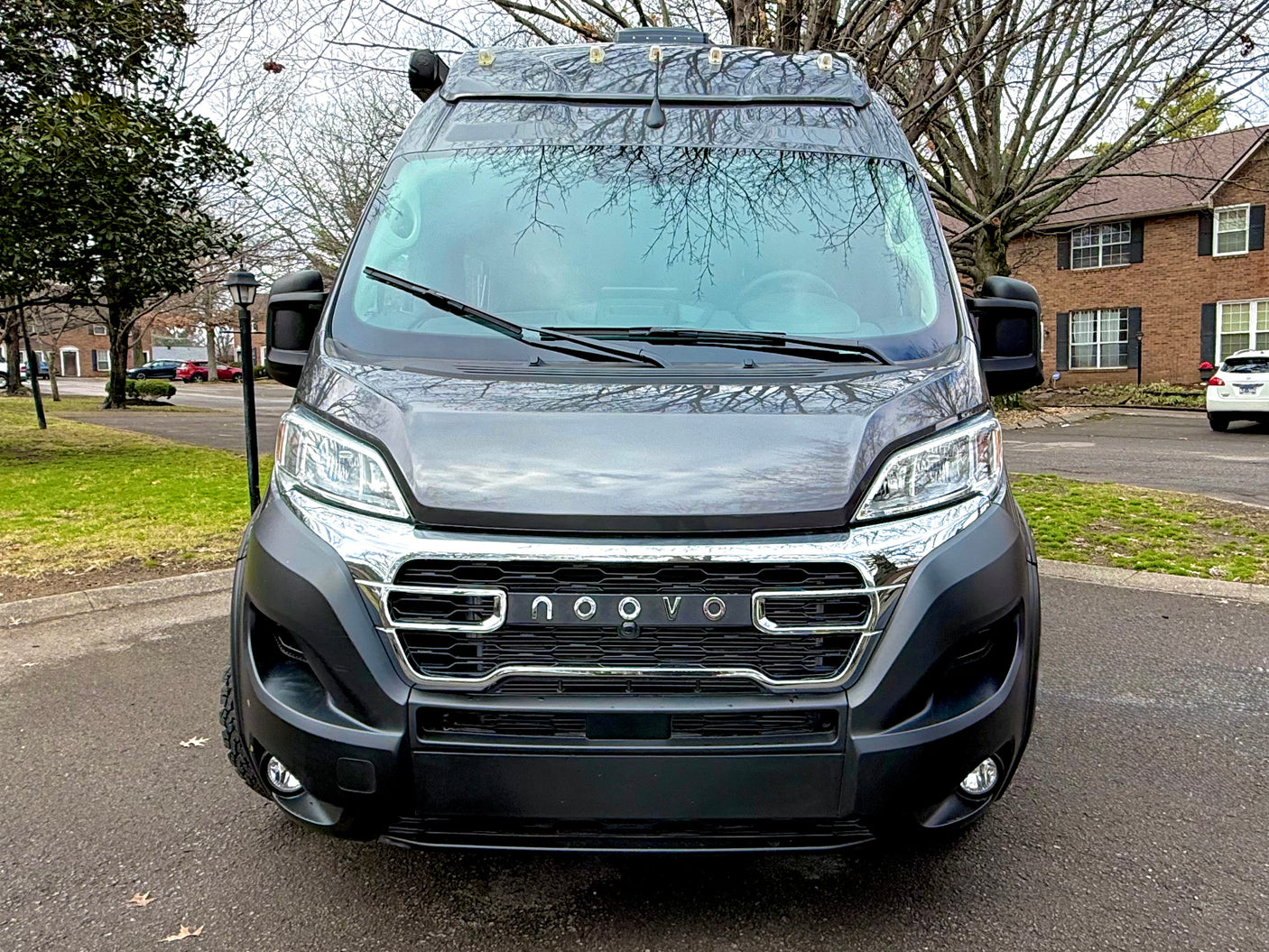Front view of a dark grey NOOVO camper van. Great RV rental for your next travel adventure.