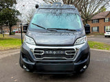 Front view of a dark grey NOOVO camper van. Great RV rental for your next travel adventure.