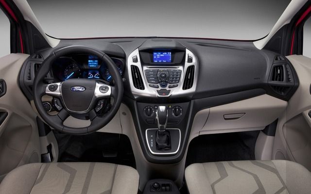  revealing ample cargo space. Perfect for an RV rental trip!|Blue Ford Transit Connect passenger van in 4 views: front — photo 4