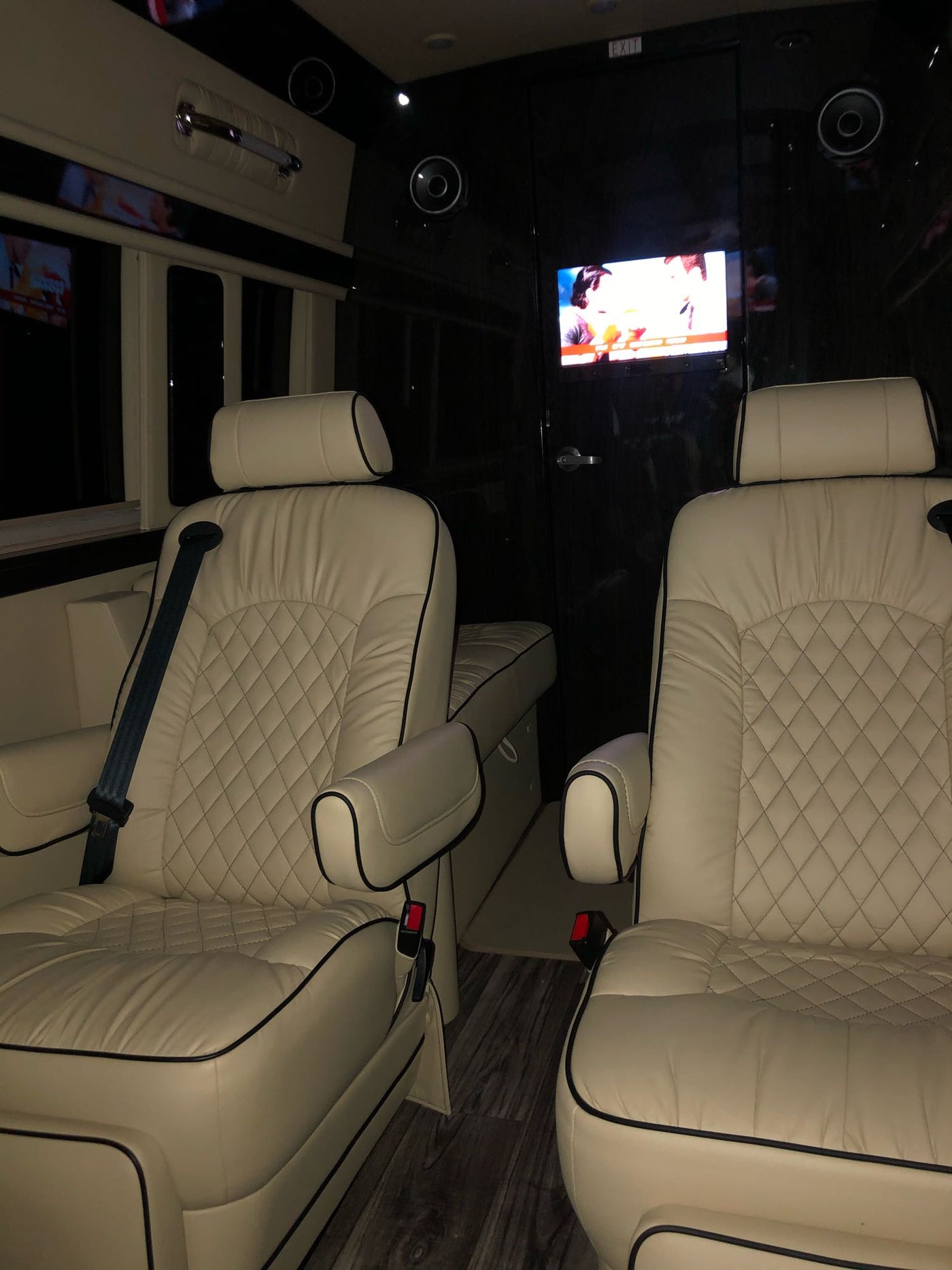 Step inside this premium RV rental: comfortable quilted seats, a TV, and speakers for a great journey. — photo 19