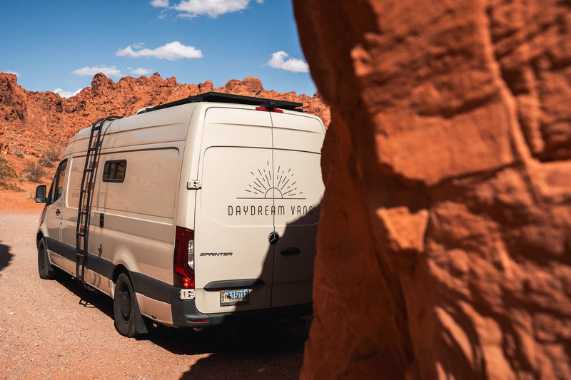 RV rental Sprinter van parked amidst stunning red rock formations. Your desert adventure awaits! — photo 7