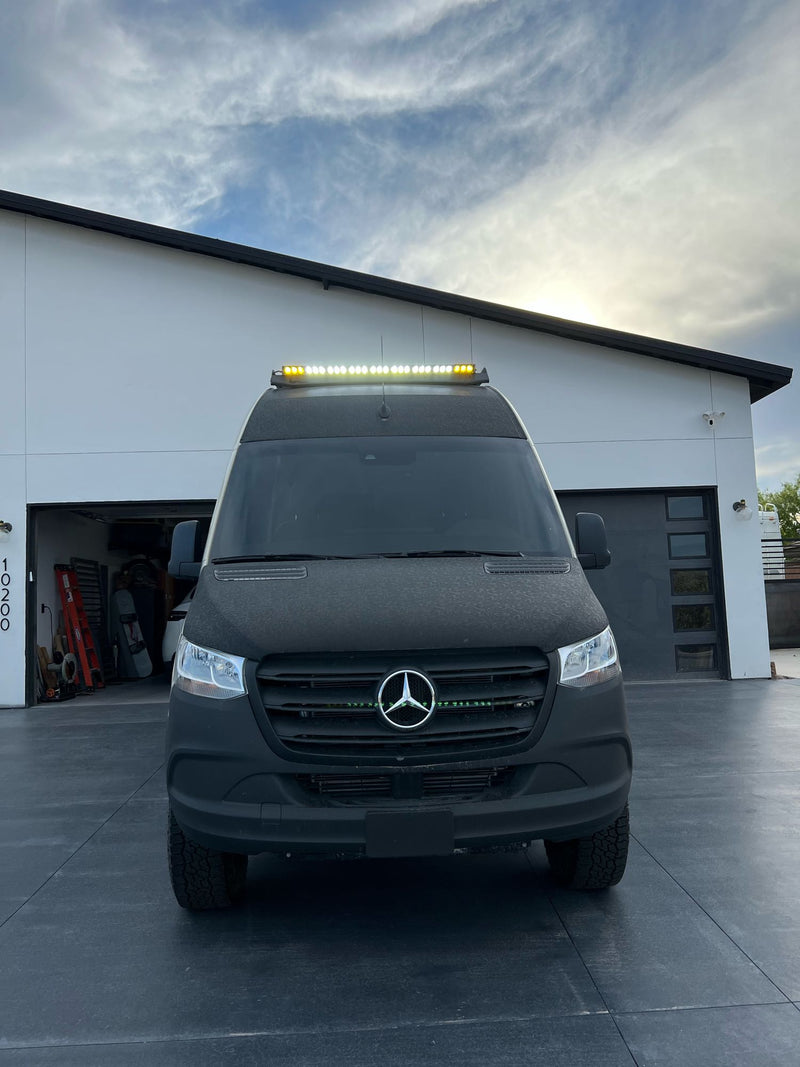  parked by a modern house.|This rugged Mercedes Sprinter adventure van — photo 10