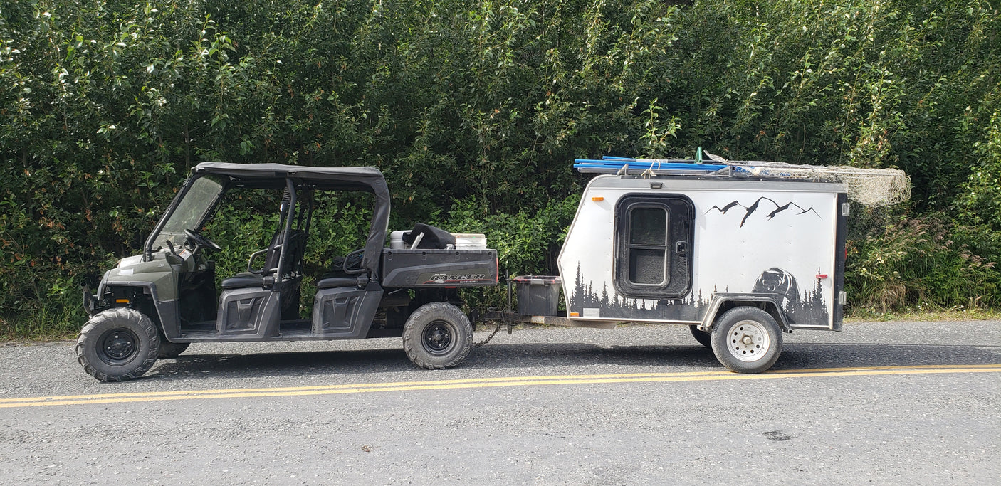Off-road Polaris Ranger UTV with custom trailer. Your next rugged RV rental for outdoor adventures!