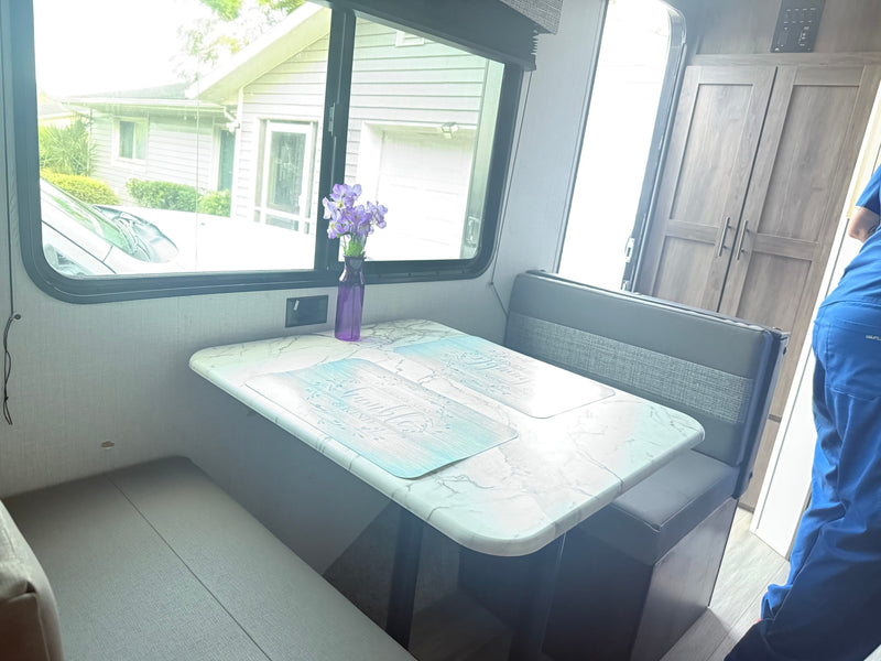  parked outdoors. Ideal for an rv rental.|Cozy RV rental bedroom featuring a bed with a unique comforter — photo 4