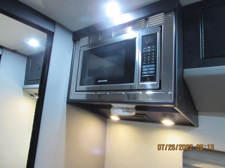  and window blinds offer comfortable travel.|RV rental interior shows a TV screen initializing a BDP-S1700 Blu-ray player