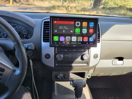 Inside an RV rental: a driver's view of the dashboard, featuring an ATOTO stereo, speedometer, and vehicle controls.