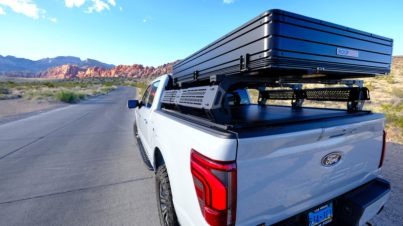 White Ford F-150 with a rooftop tent for your next rv rental adventure. Explore desert roads & mountains overlanding. — photo 6