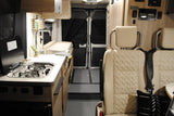 This RV rental features a compact interior with a kitchenette (sink & stove), rear passenger seating, and a Xantrex solar charge controller.