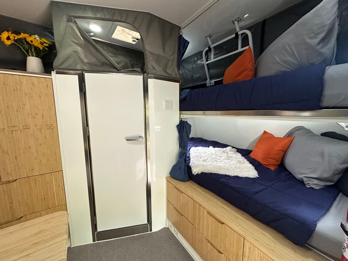  and dining table.|Cozy camper bed in this RV rental