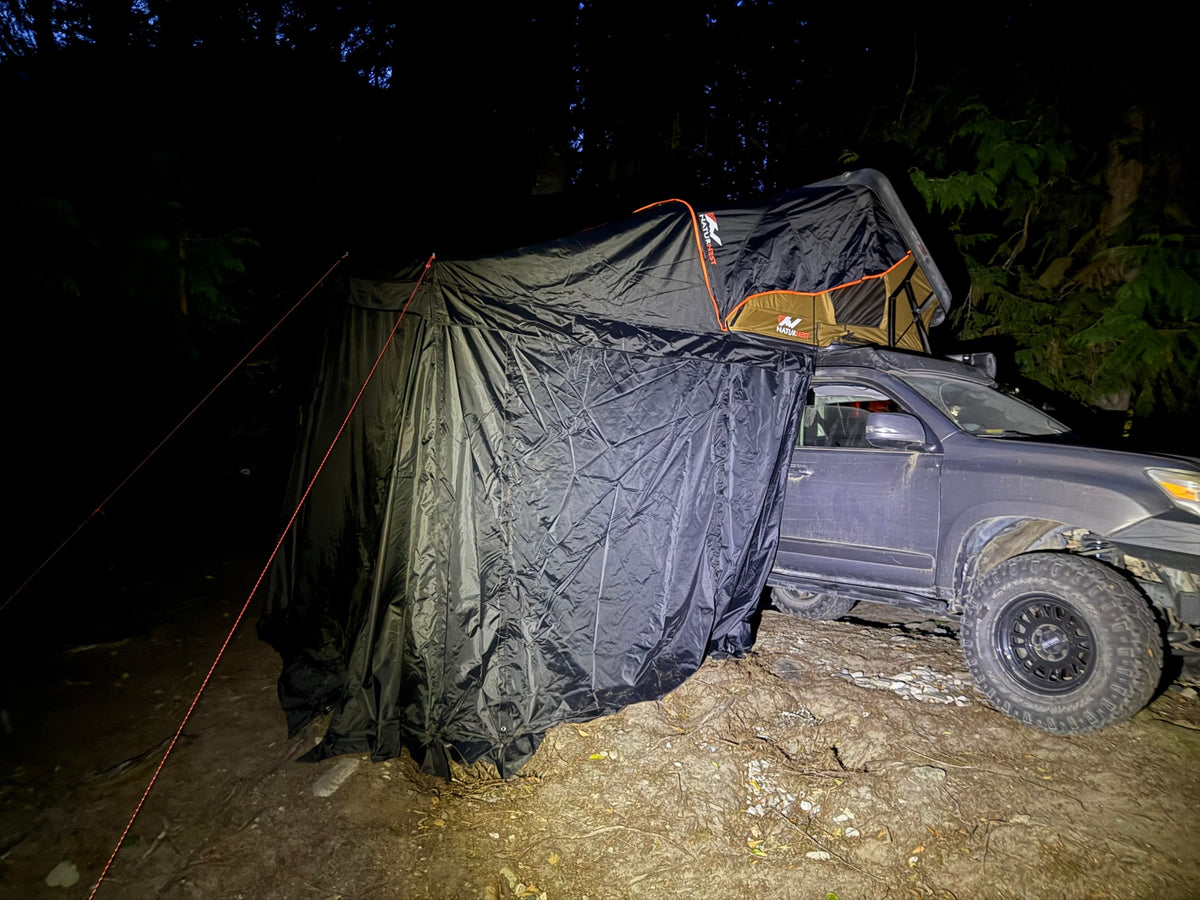 Experience night camping with this overland vehicle, rooftop tent, and awning setup. A unique outdoor rv rental adventure. — photo 2