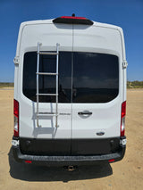 Rear view of a white Ford Transit RV rental van, featuring a ladder, tinted windows, and a tow hitch for adventures.