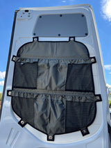 RV rental van's rear door with a multi-pocket fabric organizer, providing practical storage for essentials.