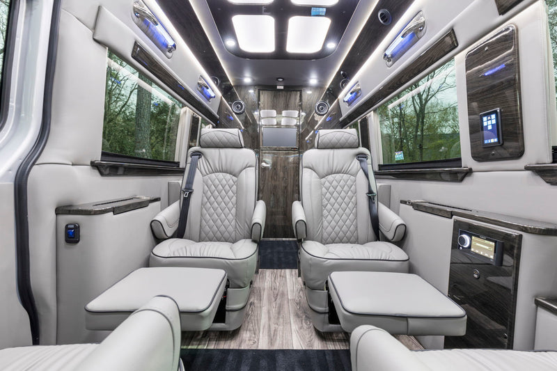  and ambient lighting for comfortable travel.|Step inside this luxury RV rental van. Plush seating — photo 8