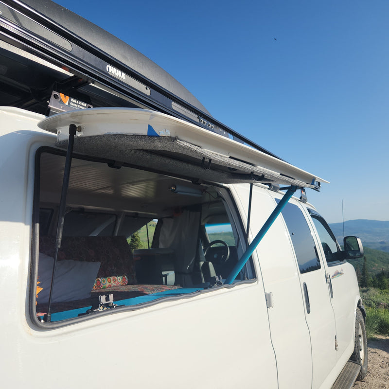Experience van life with an RV rental! White conversion van with open window overlooking scenic mountains. Perfect for adventure. — photo 7