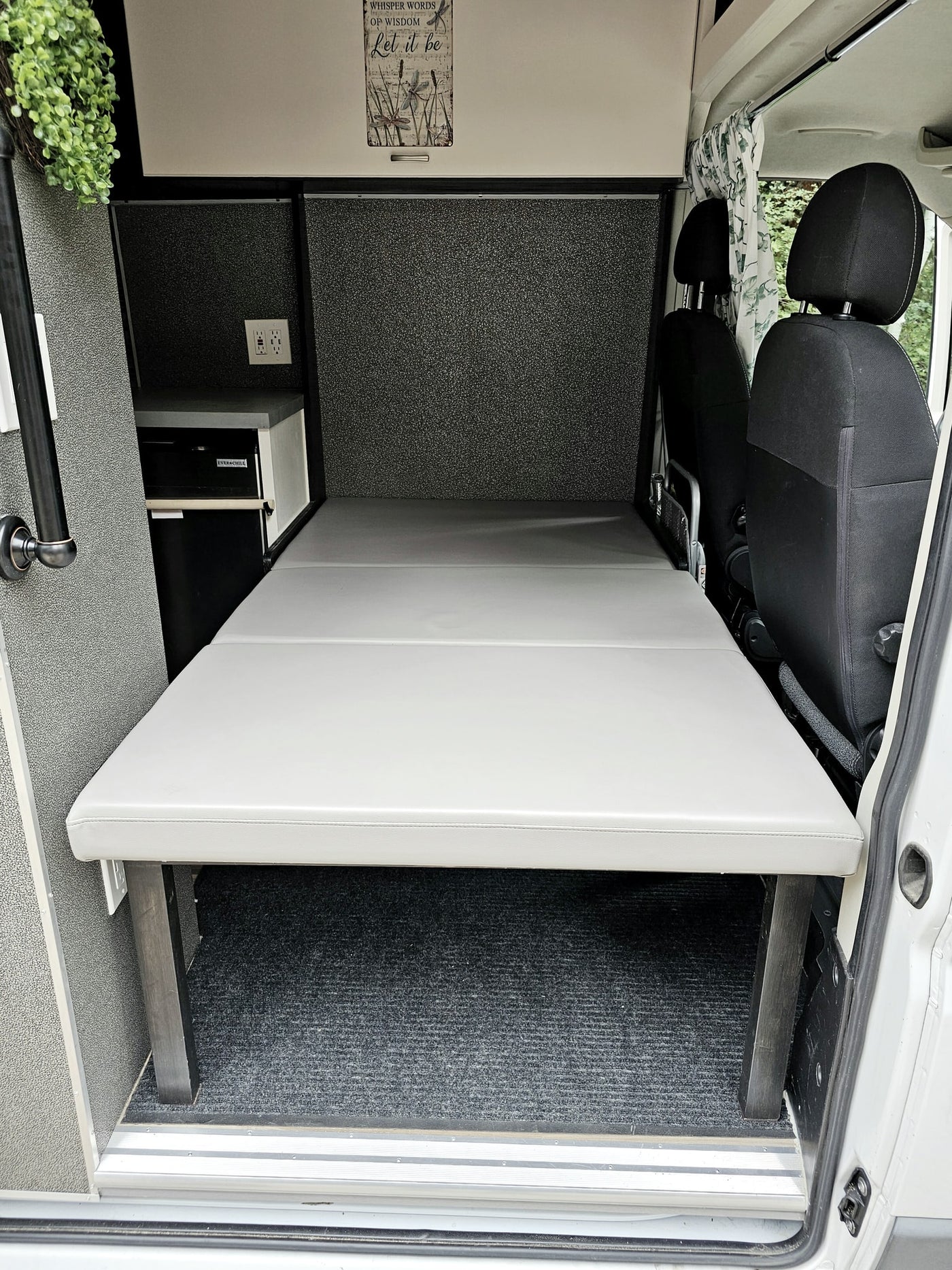  and vents for comfortable adventures.|Rear of a white Ram ProMaster rv rental van — photo 17