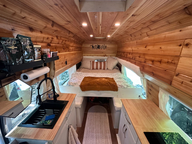  & compact kitchen area for your adventures.|Inviting RV rental interior: wood-paneled walls — photo 11