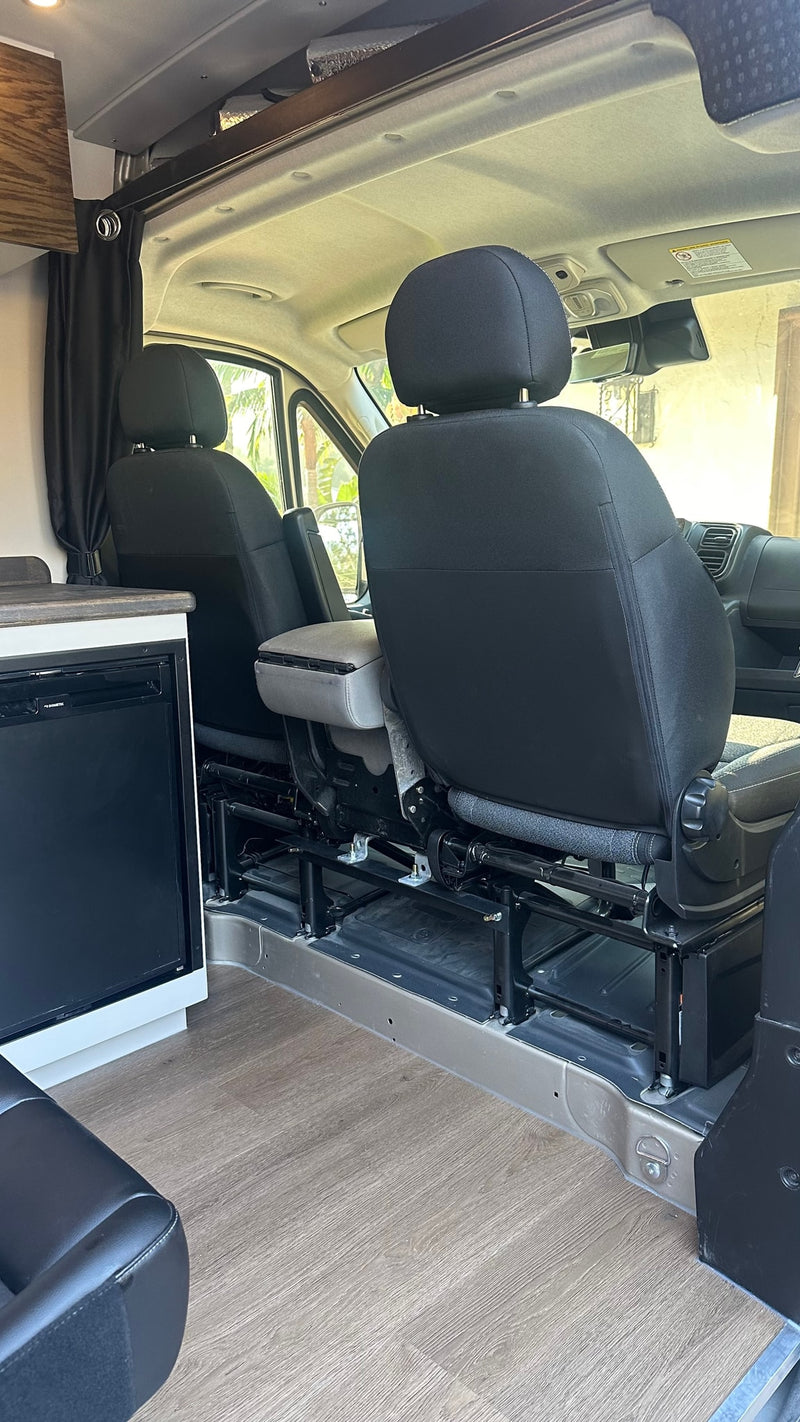  portable toilet with adjacent storage for convenient mobile travel.|RV rental: Bright camper van interior with modern kitchen — photo 12