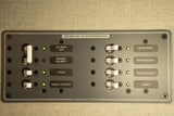 RV rental panel: 120V AC distribution with circuit breakers for microwave, refrigerator, stove, water heater, and galley outlets.