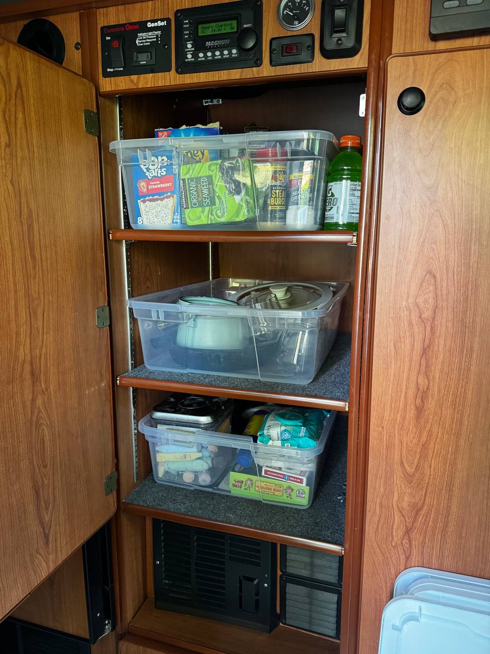  demonstrating ample headroom when extended.|RV rental interior: wood cabinetry with TV — photo 2