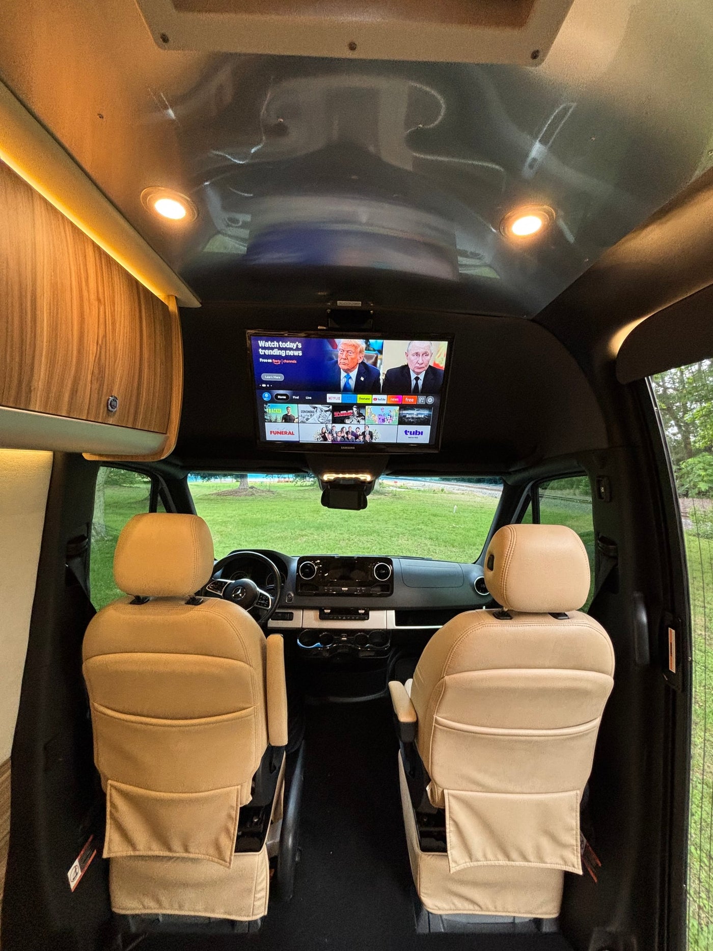  silver Airstream Interstate Tommy Bahama Solar Edition rv rental is parked on grass — photo 12