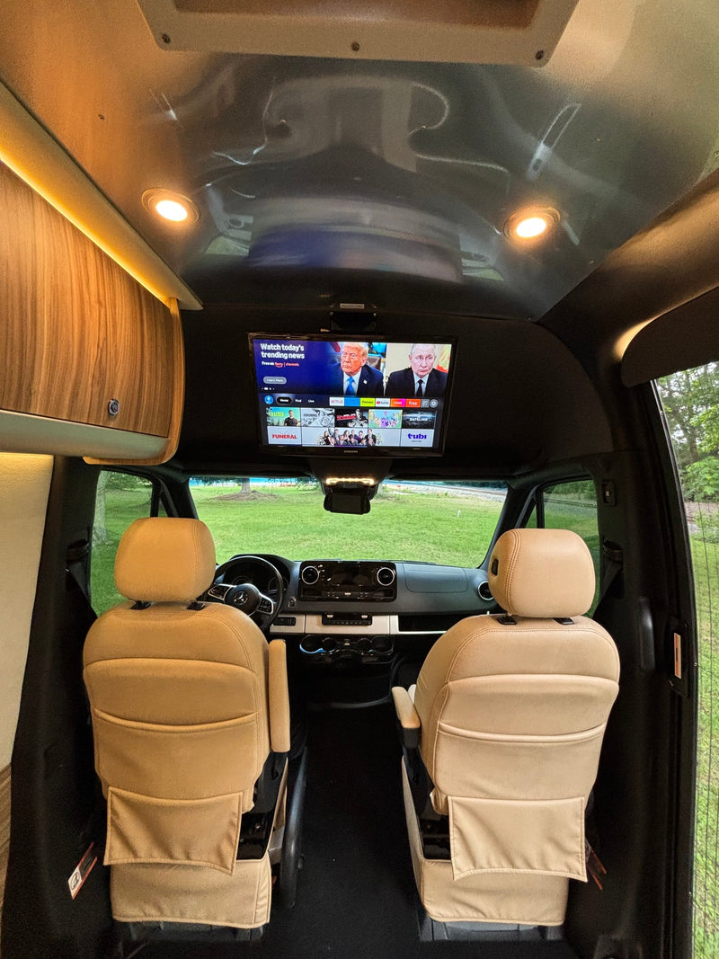  silver Airstream Interstate Tommy Bahama Solar Edition rv rental is parked on grass — photo 12
