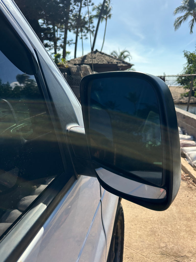 Sunny day view from an RV rental: side mirror and window show reflections of a tropical scene with palm trees and blue sky. — photo 5