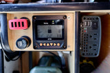 RV rental's power setup: solar charge controller (MT50), USB charging hub, and AC inverter for versatile mobile power.