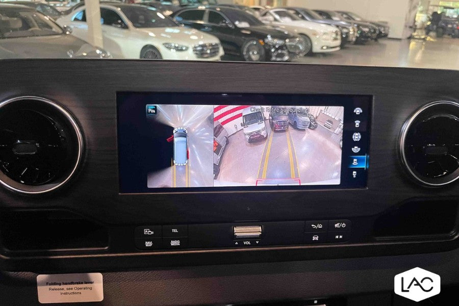 Inside an RV rental, the dashboard screen displays a 360-degree camera view for easy maneuvering in the lot.