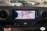 Inside an RV rental, the dashboard screen displays a 360-degree camera view for easy maneuvering in the lot.