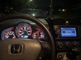 Illuminated Honda car dashboard at night with navigation screen showing a connection error. A compact ride, unlike an RV rental.