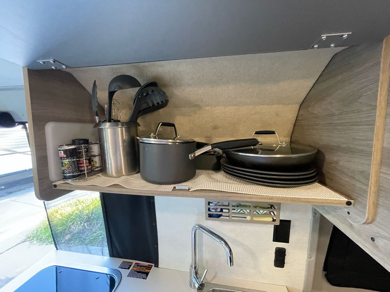  showcasing its compact kitchen — photo 10