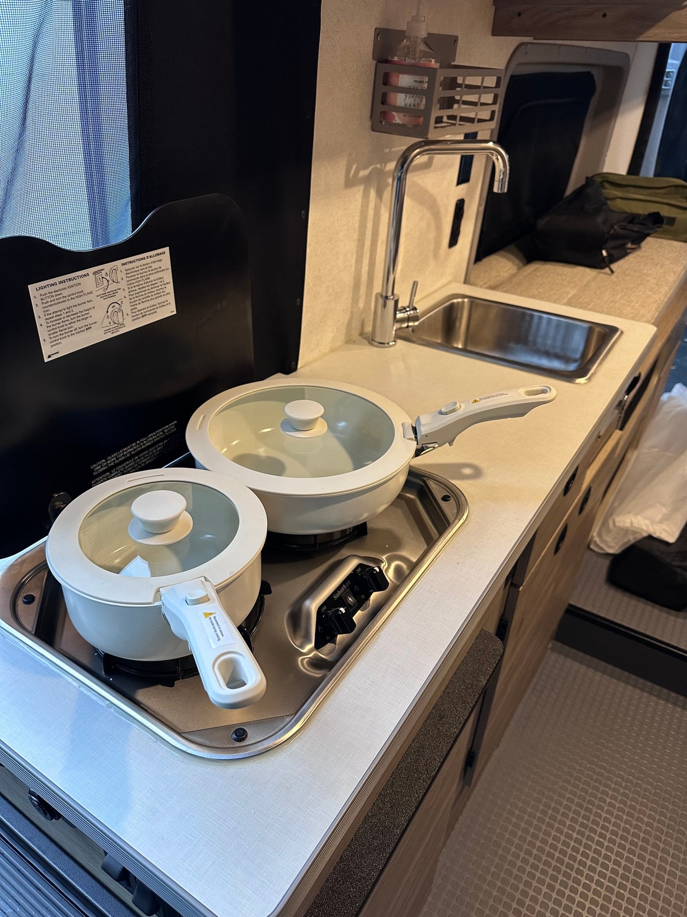  and expansive screened views for a great trip.|Cozy rv rental interior: kitchen with stove & sink — photo 9