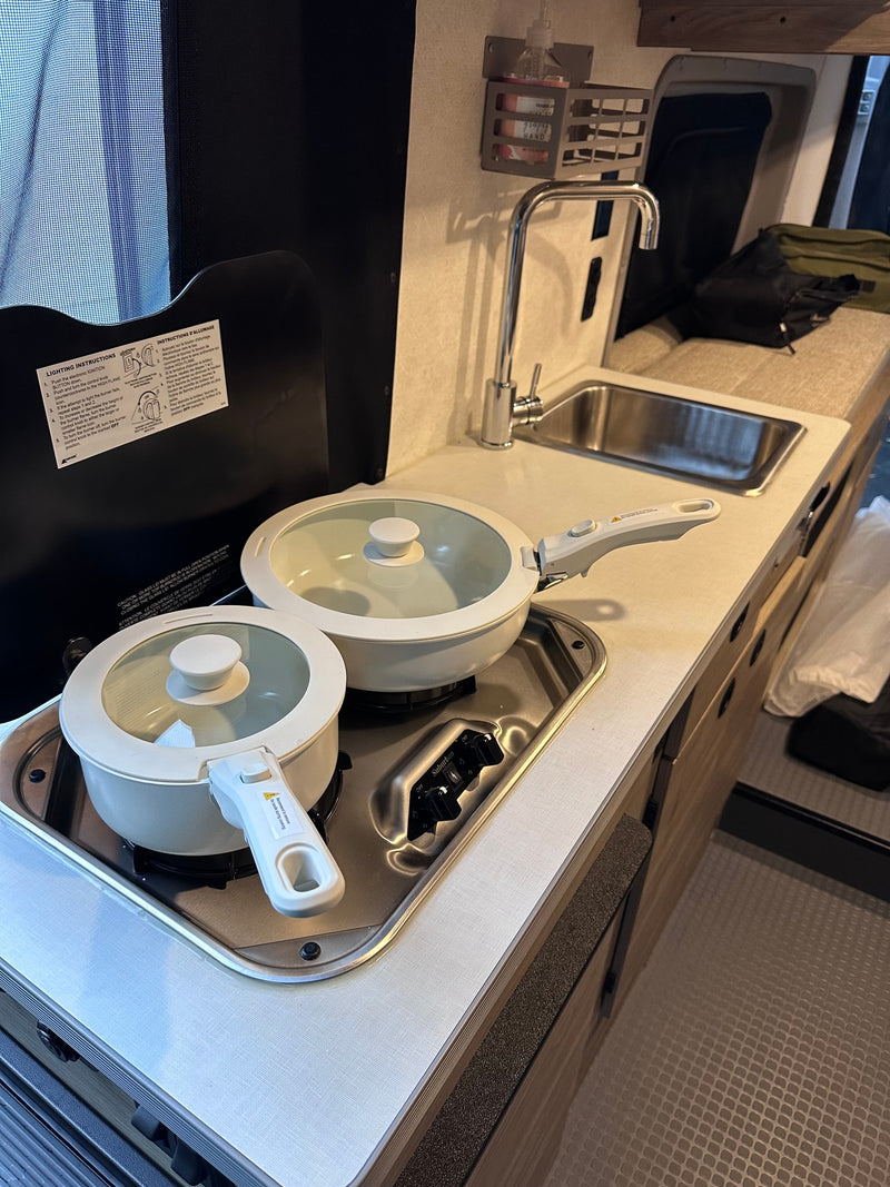  and expansive screened views for a great trip.|Cozy rv rental interior: kitchen with stove & sink — photo 9