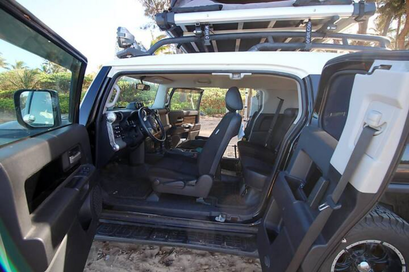 Discover the spacious interior of this Toyota FJ Cruiser 4x4, perfect for an RV rental and overlanding trip with its roof top tent. — photo 6