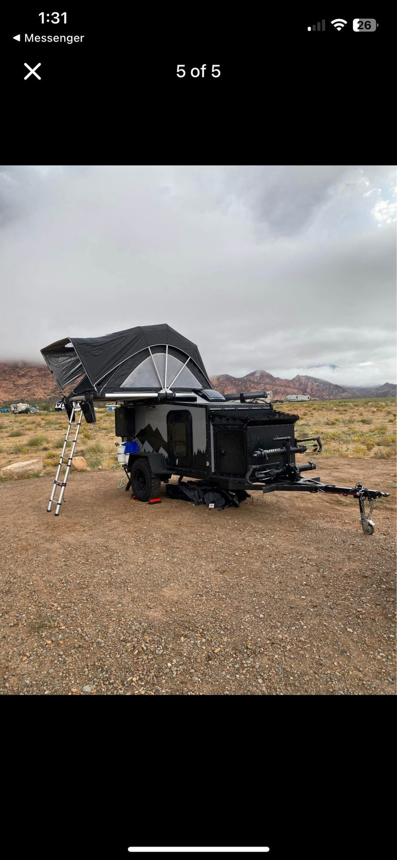 This rugged overland camper trailer, featuring a deployed rooftop tent, is an ideal RV rental for off-road adventures. — photo 1