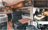 RV rental: full interior view from cockpit to cozy rear bed. Features include swivel seats, table, modern kitchen, and storage.