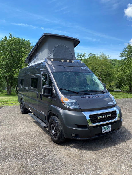 Dark gray Ram ProMaster pop-top camper van, an ideal rv rental for Alaska travel and adventures.