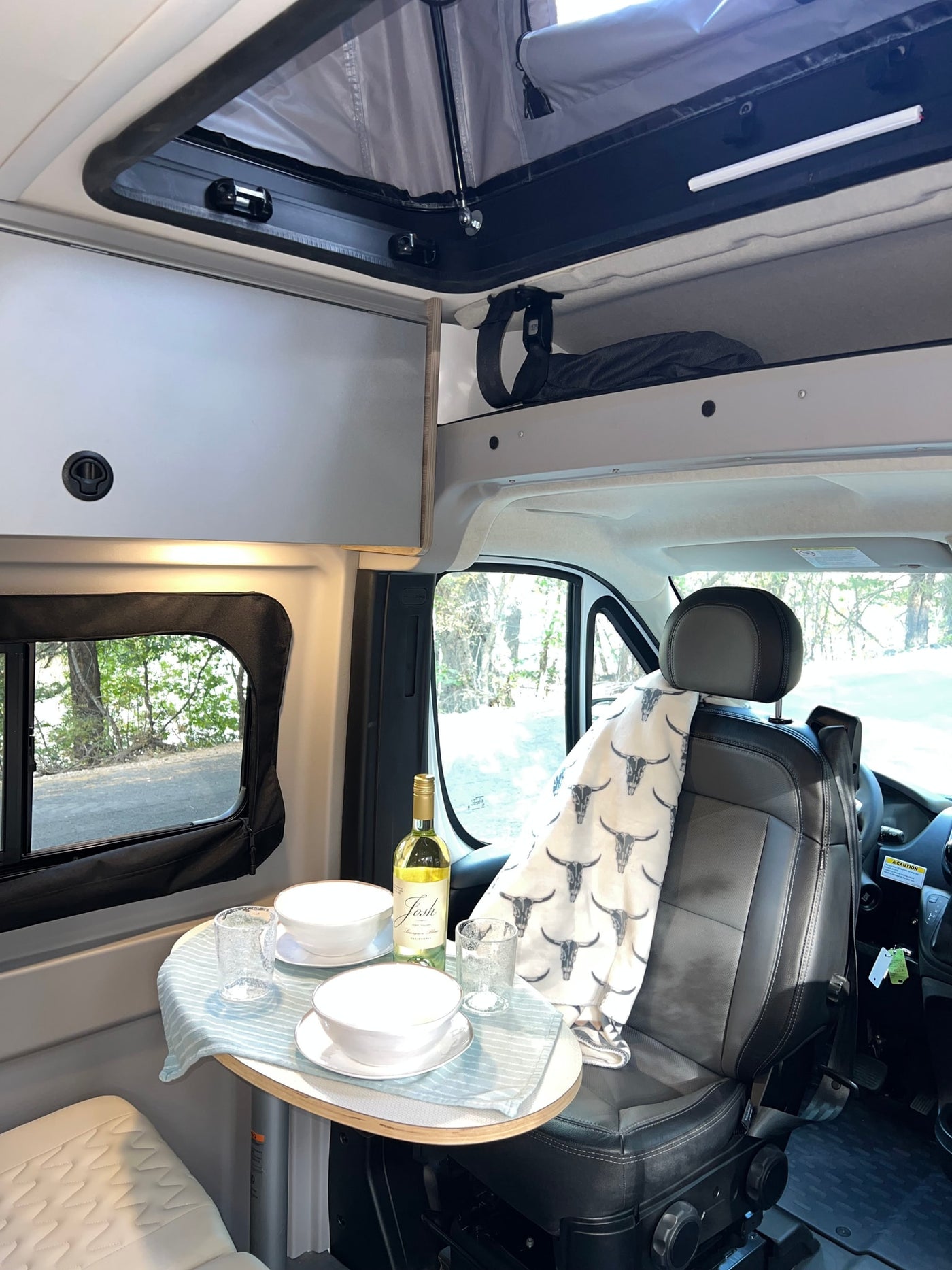  and a magnetic screen door.|Cozy RV rental interior with a comfortable bed — photo 19
