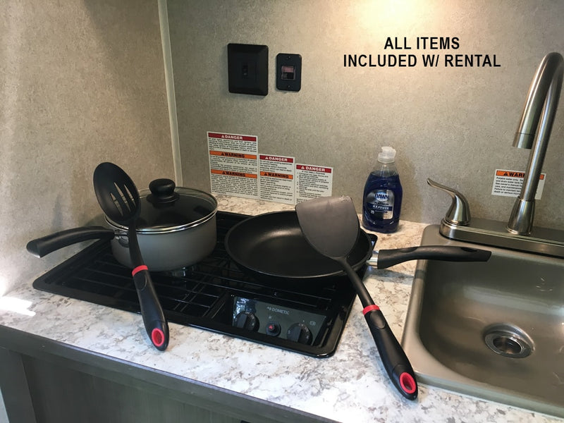 RV rental kitchen: stove, sink, pots, pans, utensils, and dish soap, all included for your convenience. — photo 17