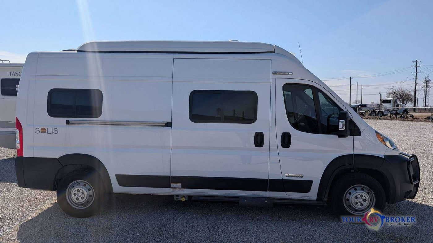  and an integrated shower for convenient travel.|RV rental kitchen setup: Two-burner stove with cover open — photo 15