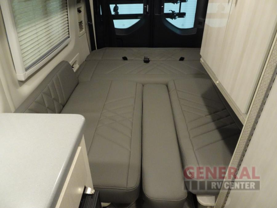  ready for your trip.|Inside a modern **rv rental**: front cabin view with TV — photo 12