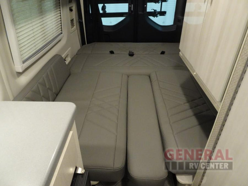  ready for your trip.|Inside a modern **rv rental**: front cabin view with TV — photo 12
